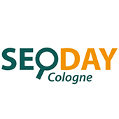 Als Logo der Referenzen bei SEO DAY Cologne, ist ein zweifarbiges Logo zu sehen.